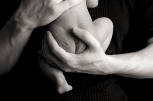 Father Holding Newborn Baby