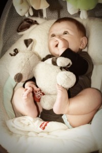 Cute Baby Playing in Fisher Price Papasan Swing