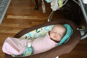 baby sleeping in papasan swing